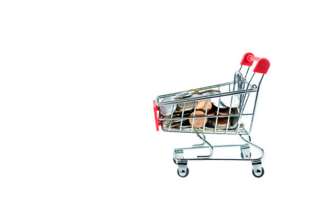 istock shopping cart with coins isolated 898271600