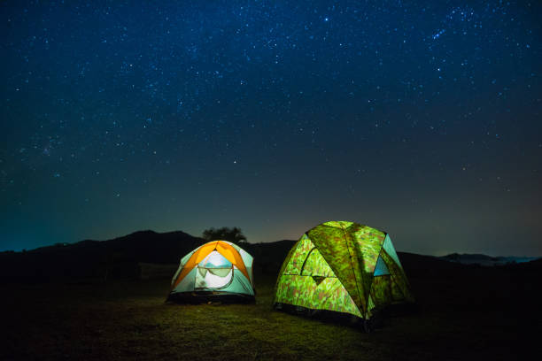 istock camping in moutain at night with star. 898274034