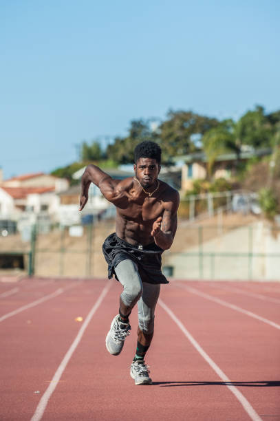 istock Athlete working out at local stadium 898274532