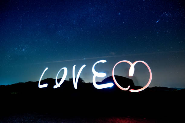 istock Love light paining alphabet over Stars in the night sky. 898274738