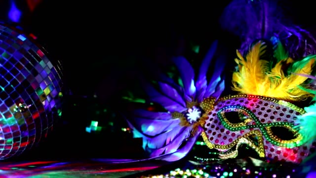 Mardi Gras, Rio carnival mask and colorful beads and feather decorations.