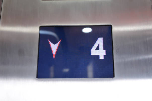 Digital display showing four floor number inside elevator stock photo