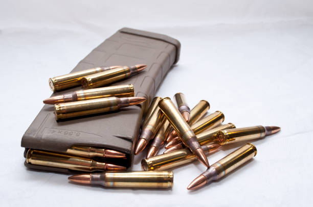 .223 bullets with a loaded magazine - full metal jacket imagens e fotografias de stock