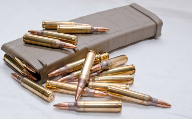 .223 bullets with a loaded magazine - full metal jacket imagens e fotografias de stock