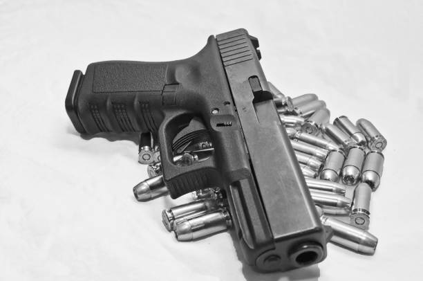 istock Pistol and ammo in black and white 898278768