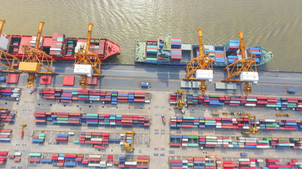 istock Logistics and transportation of Container Cargo ship and Cargo working crane bridge in shipyard 898280370
