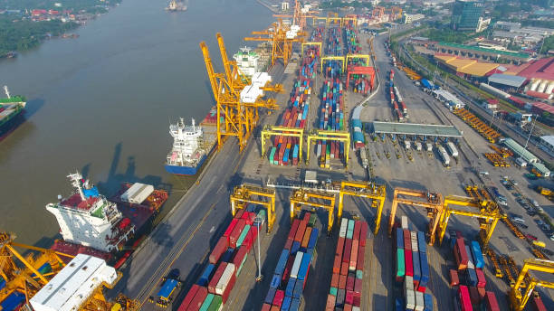 istock Logistics and transportation of Container Cargo ship and Cargo working crane bridge in shipyard 898280394