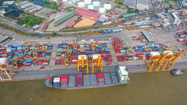 istock Logistics and transportation of Container Cargo ship and Cargo working crane bridge in shipyard 898280428