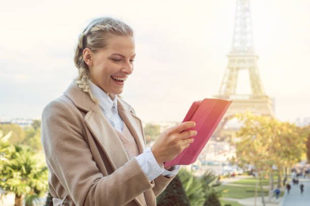 istock Caucasian woman in Paris looking at digital tablet, connection concept 898287706