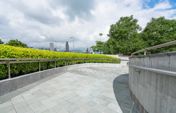 istock Empty concrete footpath near by office block building 898290544