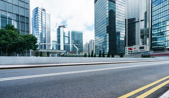 empty urban road with city skyline on background,Hong Kong,China,Asia.