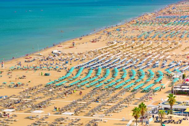 Aerial view of Rimini beach with people and blue water. Summer vacation concept. Aerial view of Rimini beach with people and blue water. Summer vacation concept rimini stock pictures, royalty-free photos & images