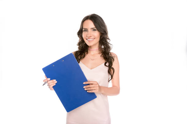 istock beautiful woman with clipboard 898295758