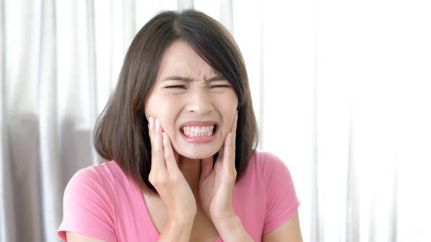 istock woman with toothache 898296000