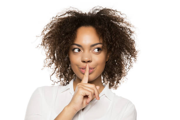 istock african american girl gesturing for silence 898297688