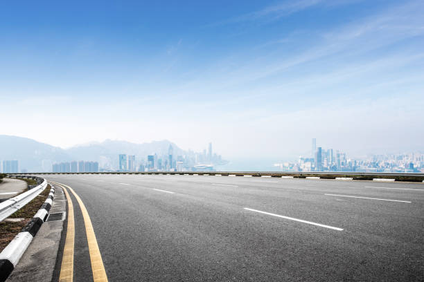 istock empty asphalt road with cityscape of modern city 898297792