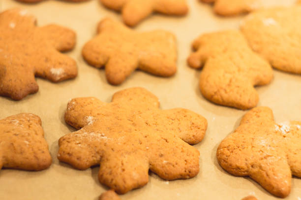 istock Ginger biscuits lie on a baking sheet. Cookies on baking paper. 898297854