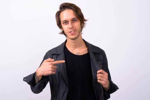istock Studio shot of rebellious young man against white background 898298094