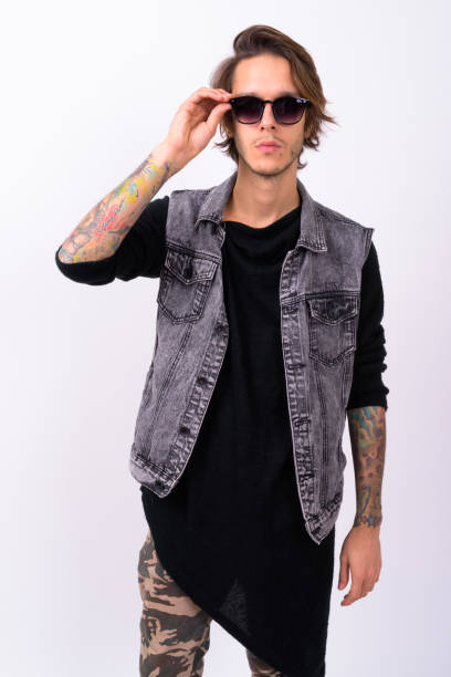 istock Studio shot of rebellious young man against white background 898298316