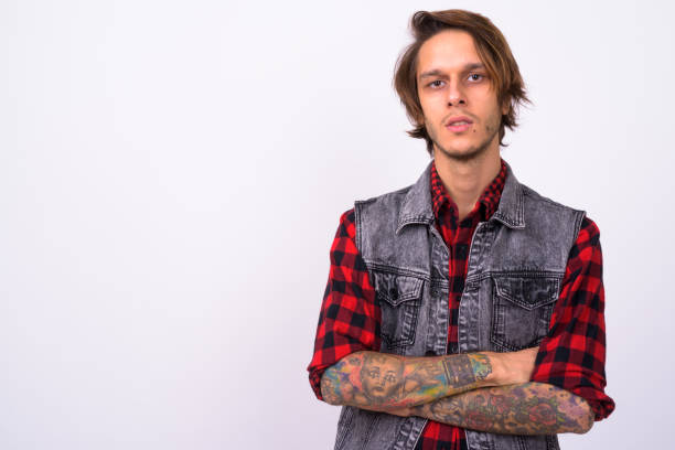 istock Studio shot of rebellious young man against white background 898298684