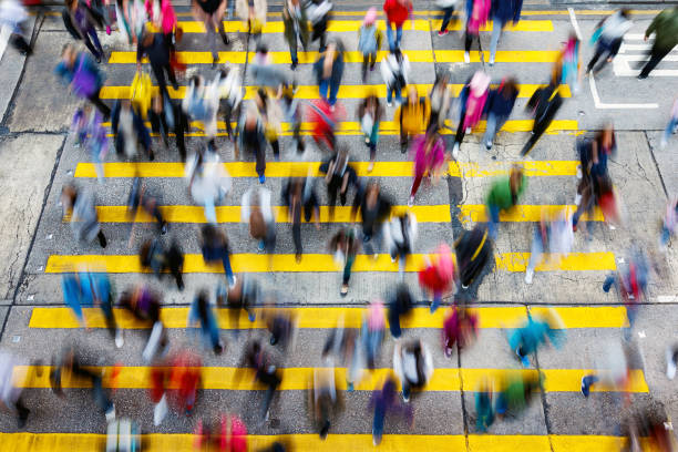 busy pedestrian crossing at hong kong - yellow city speed road imagens e fotografias de stock