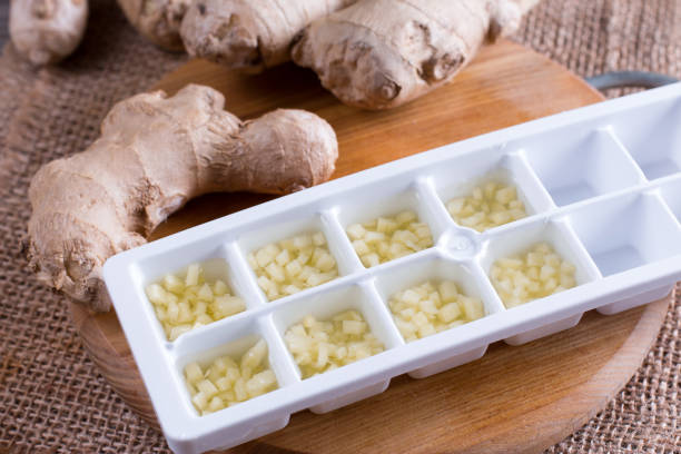 istock Frozen ginger cubes on a cutting board on a wooden table 898299628