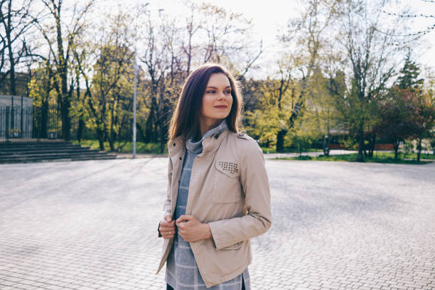 istock Slender woman in a beige jacket 898301482