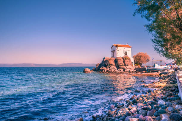 The little church of Panagia gorgona situated on a rock in Skala Sykamias stock photo