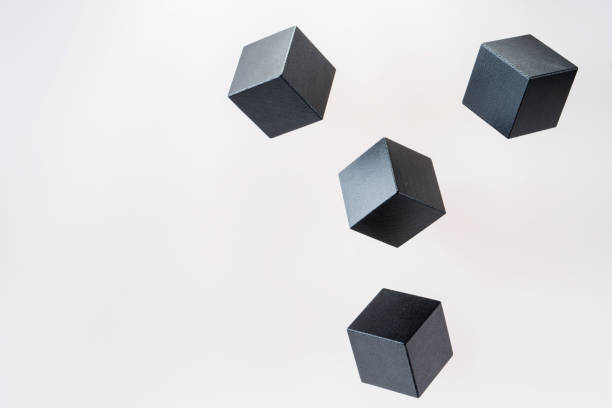 istock Black wooden cube shapes are floating. Concept of creative, logical thinking. Abstract geometric real floating wooden cube. 898315232