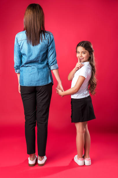 istock Daughter showing silence sign 898317840