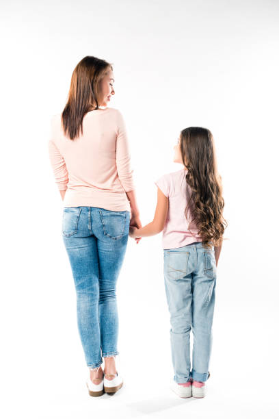 istock mother and daughter holding hands 898319842