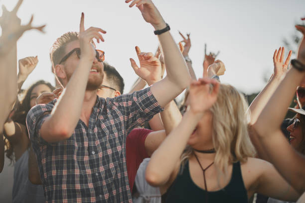 istock Crowd of people dancing at festival 898325464