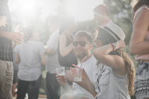 istock Couple sitting at outdoor party 898325466