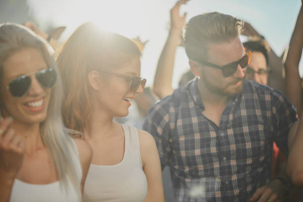 istock Crowd of people dancing at festival 898325536