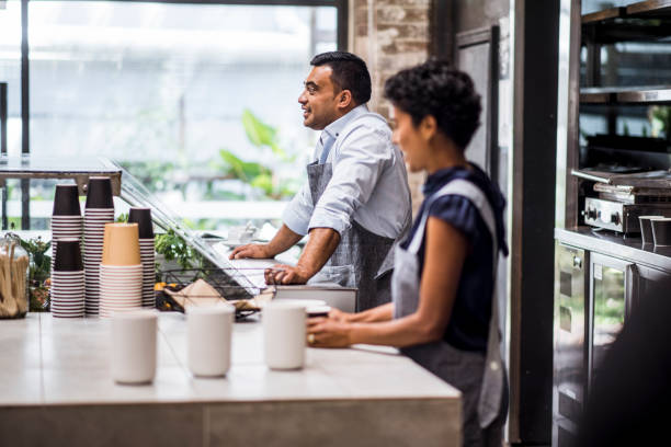 istock Baristas making coffees in a coffee shop 898332506