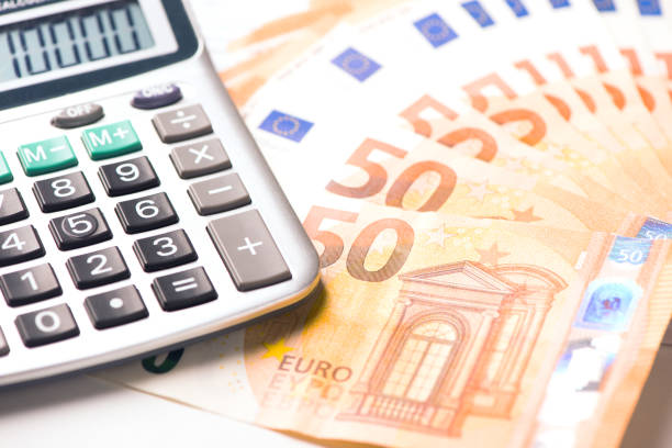 istock Calculator and euro money on a table desk 898333216