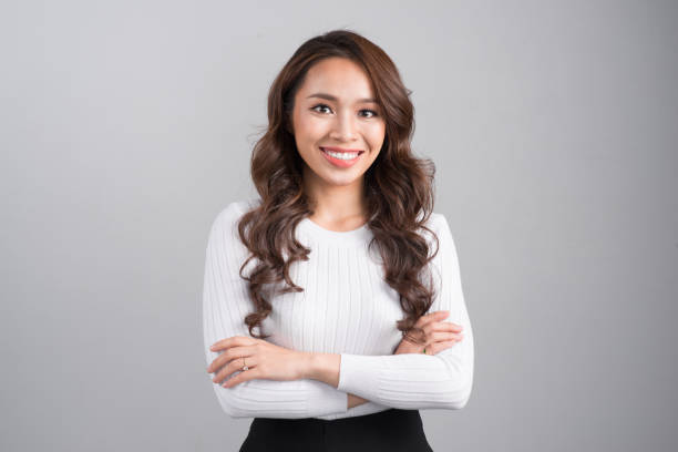 istock Smiling confident businesswoman isolated on grey background. 898333450