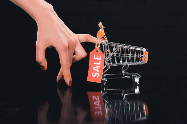 istock shopping cart with sale tag 898333472