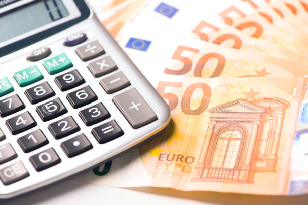 istock Calculator and euro money on a table desk 898333728