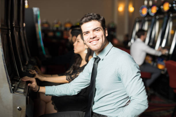 istock Man having good time in a casino 898339330