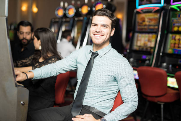 istock Happy man playing in a casino 898339644