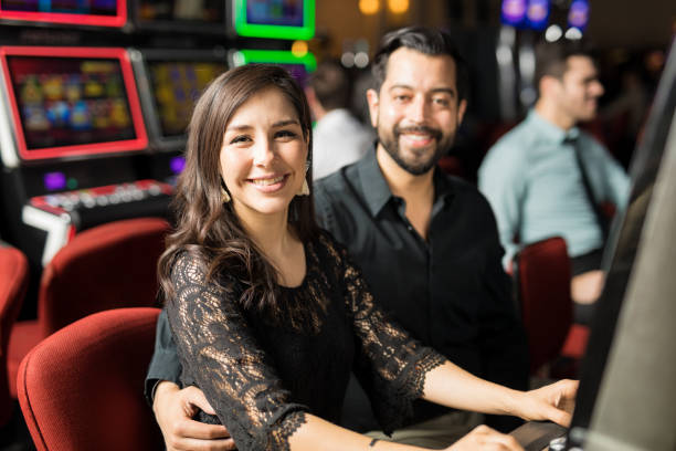 istock Couple having date in a casino 898339676