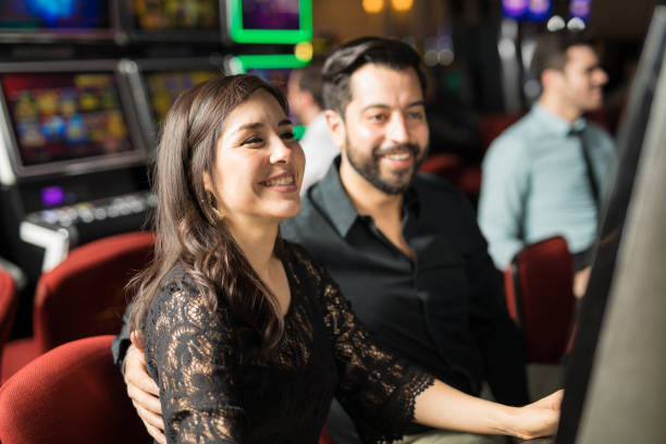 istock Happy couple having fun in a casino 898339960