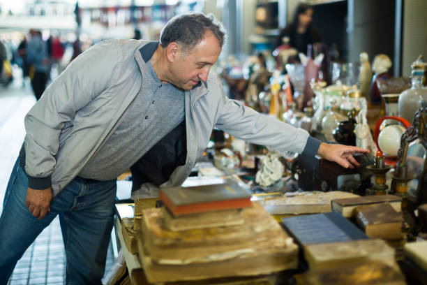 istock Adult man buying retro handicrafts 898344376