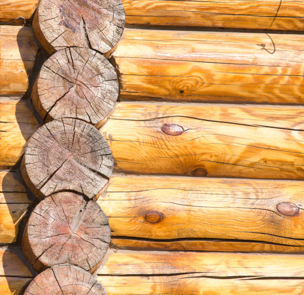 istock Wall of a house with a log frame as a background 898345518