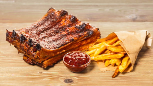 istock grilled ribs with fries and sauce 898345580