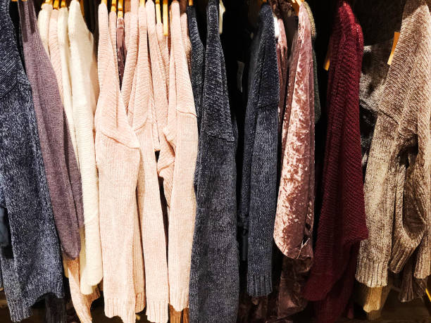 istock Sweaters on the hanger in the store. 898345642