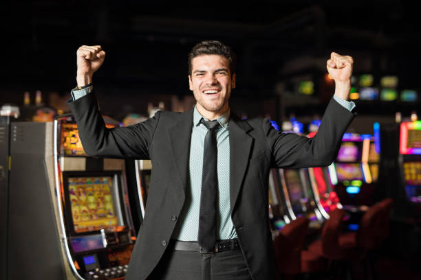 istock Man winning money in a casino 898346314