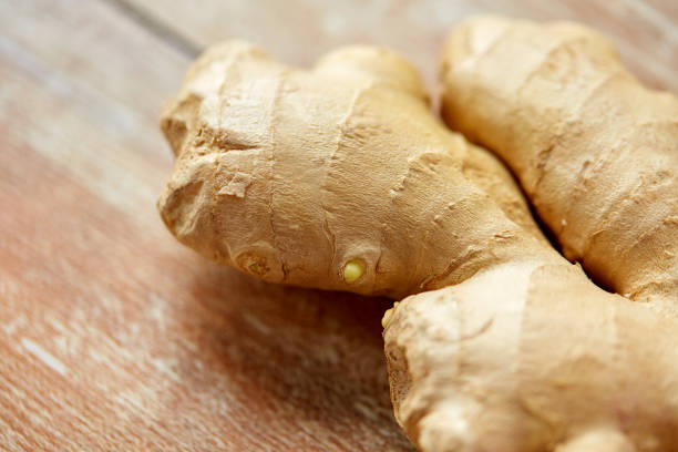 istock close up of ginger root on wooden table 898348276