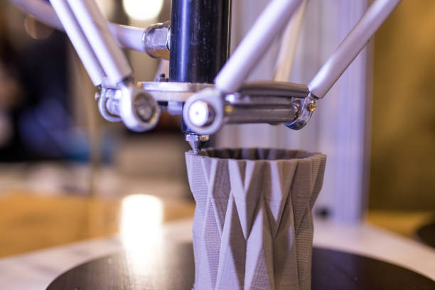 istock 3d printer in the process of making a geometric vase 898348366
